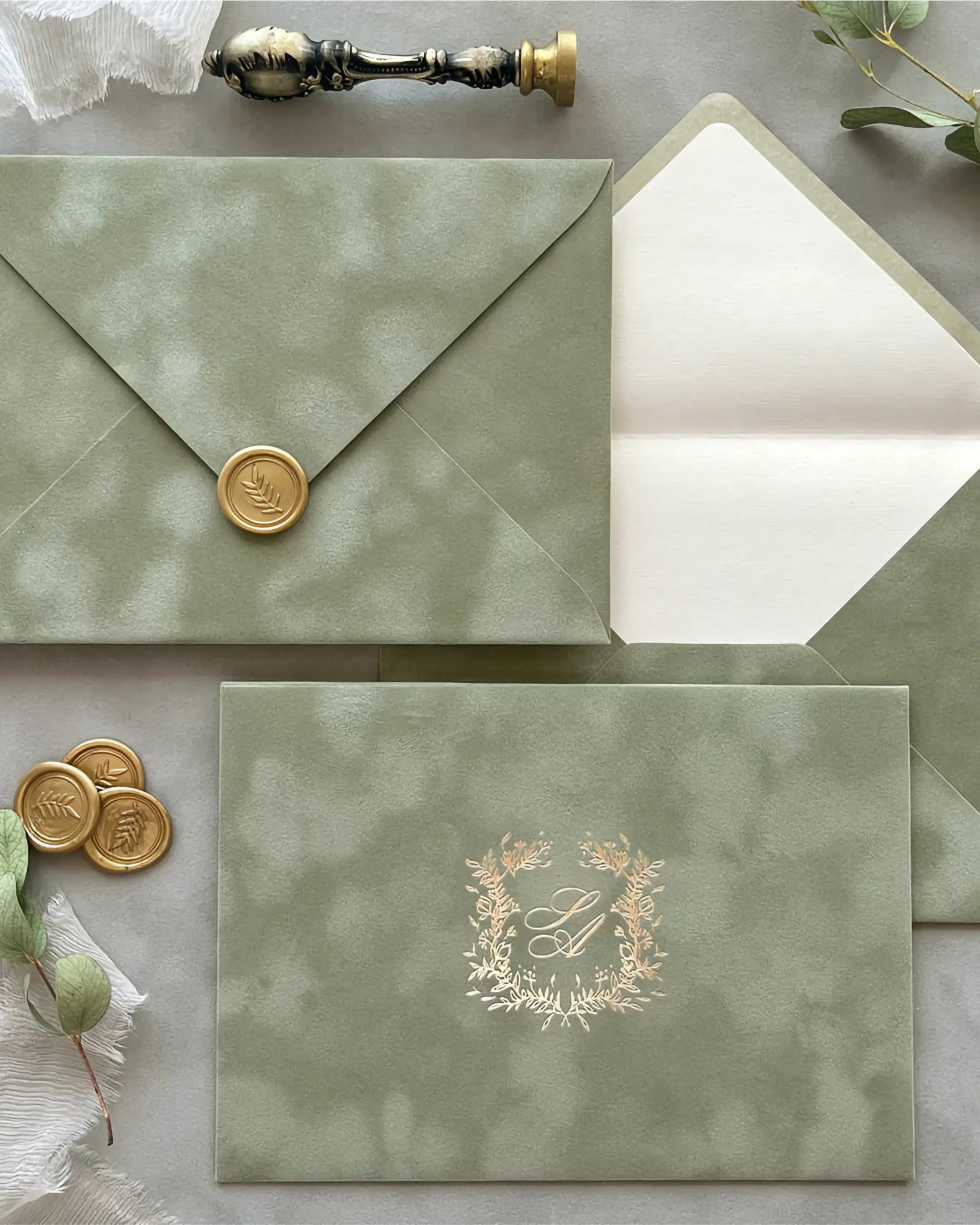 Sage Green velvet envelope with gold wax seal and foil monogram wreath, cream paper lining — Polina Perri